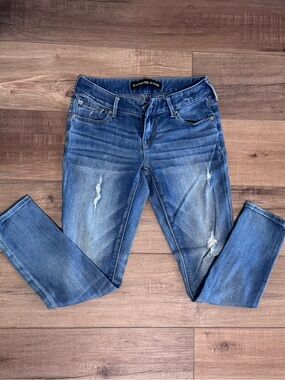 Express Women's Low Rise Ankle Skinny Jeans in Faded Blue with Distressing